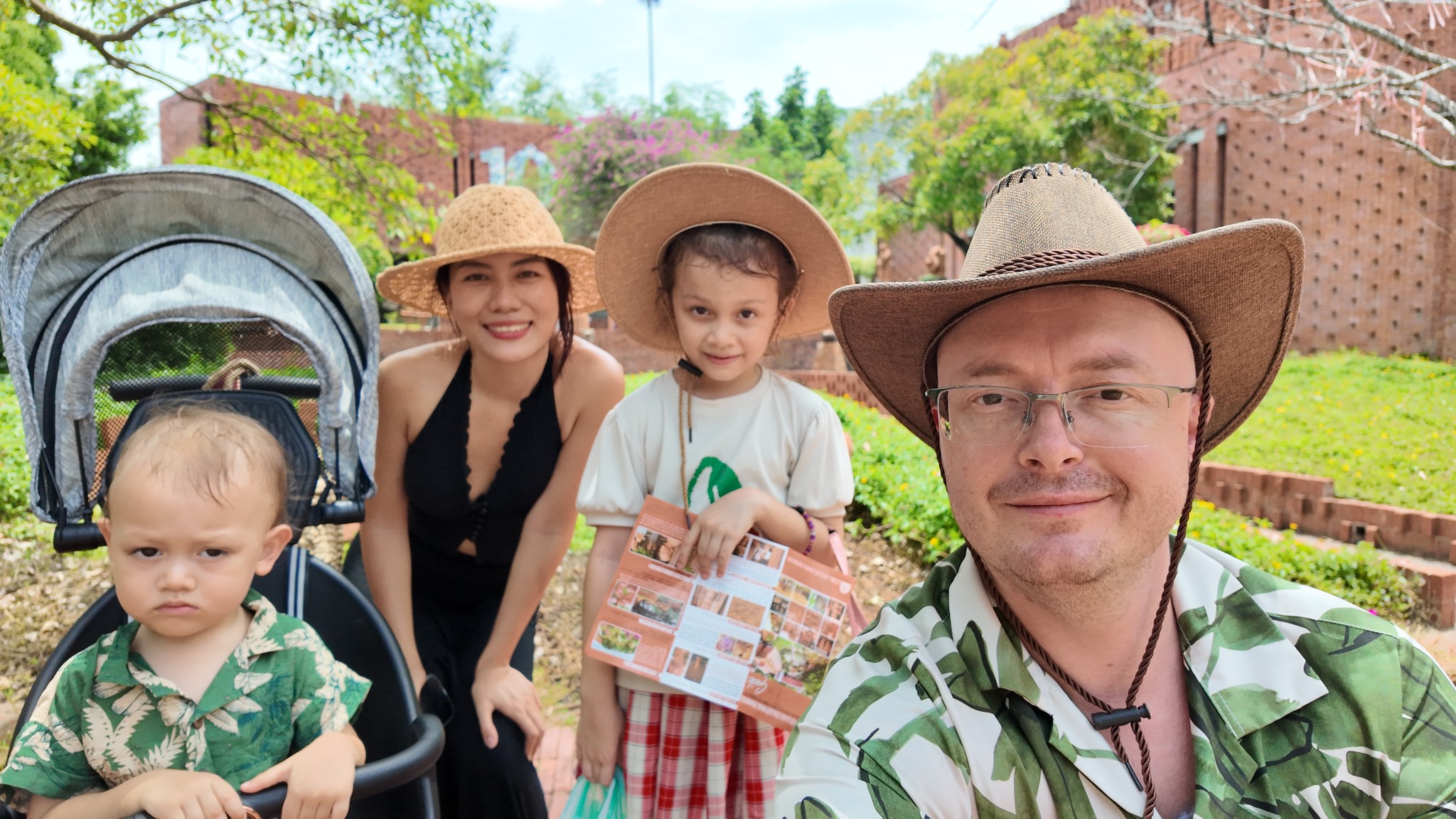 Jack with his family, outdoors in cowboy hats